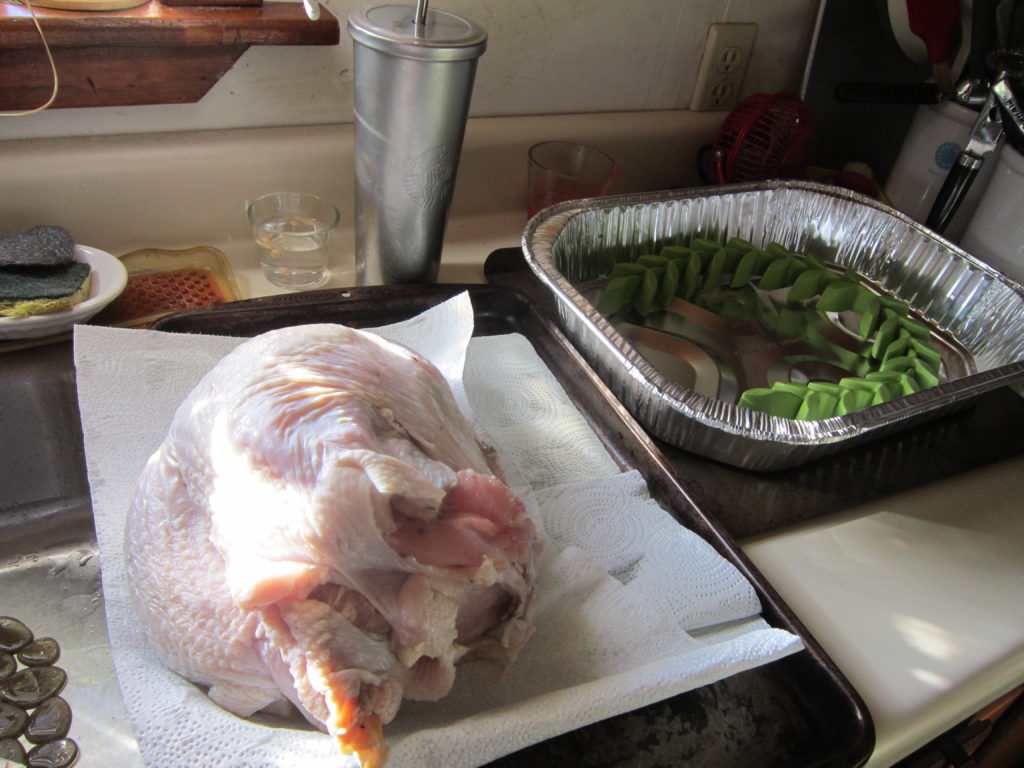 Drying off the turkey means the butter will rub on easier and stick better.