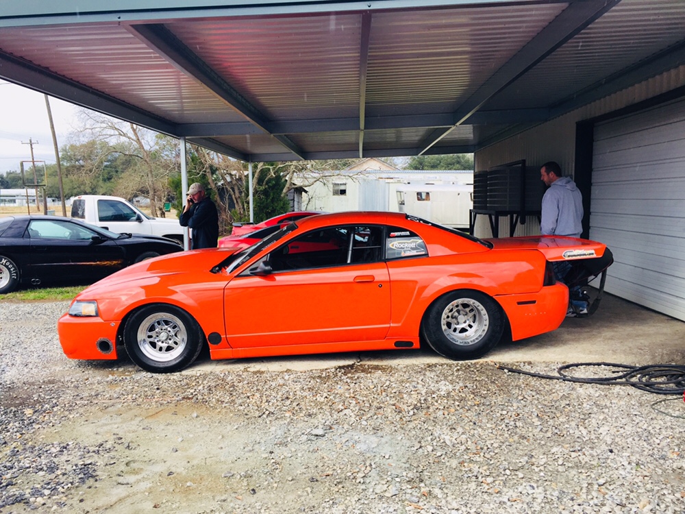 orange car at barbecue