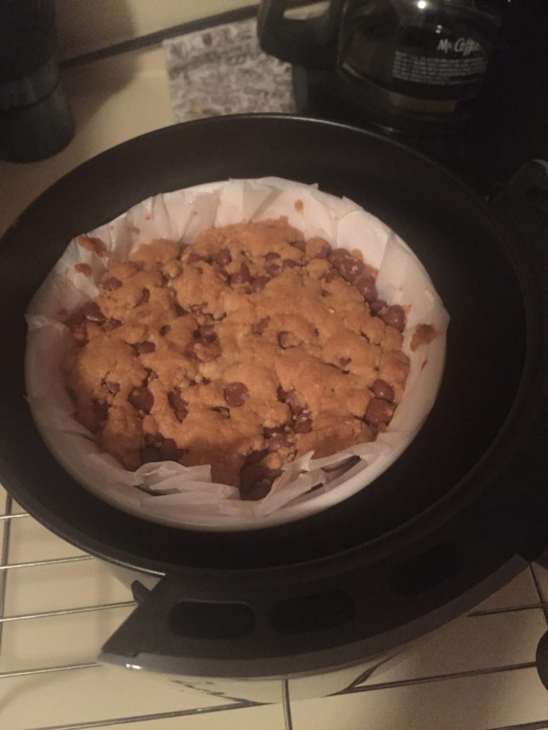 Putting cookie into air fryer