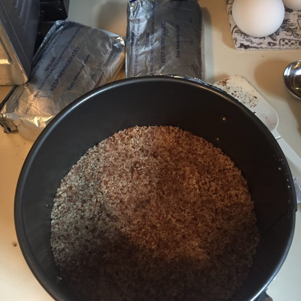 Keto nut crust in the bottom of the springform pan