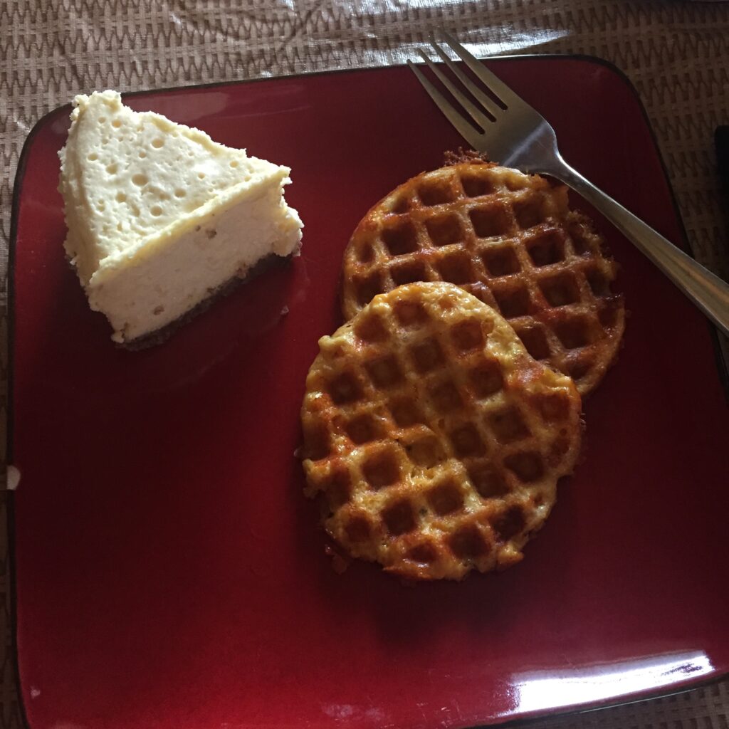 Chaffles and cheesecake on square red plate