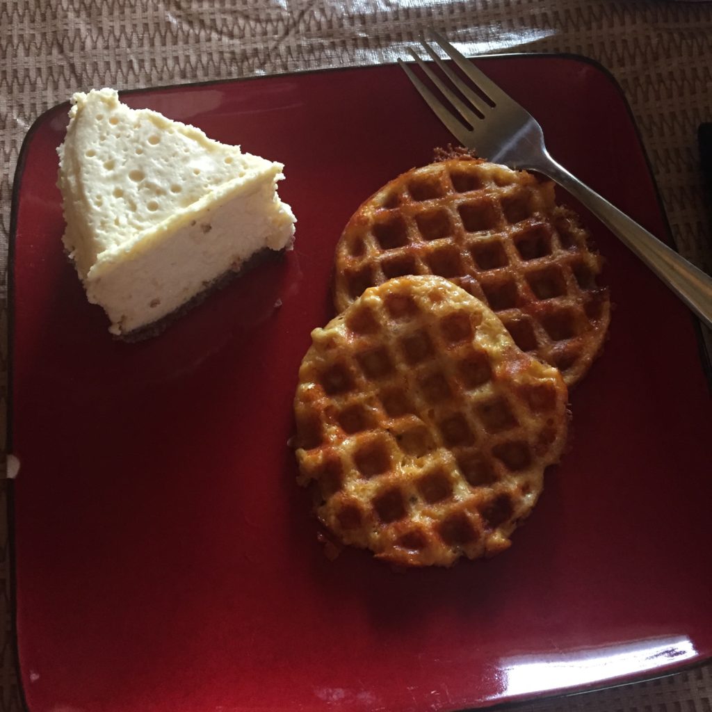 Cheesecake with chaffles on a red plate