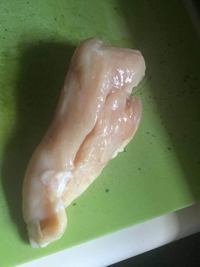 chicken breast on cutting board