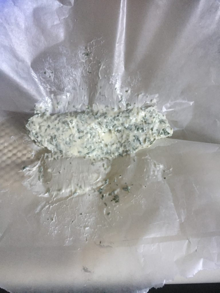 Rolling the compound butter into a log