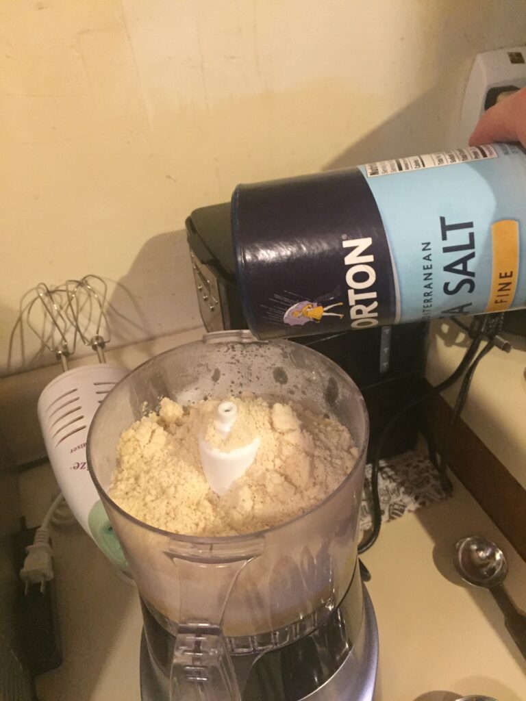 Pouring salt into food processor