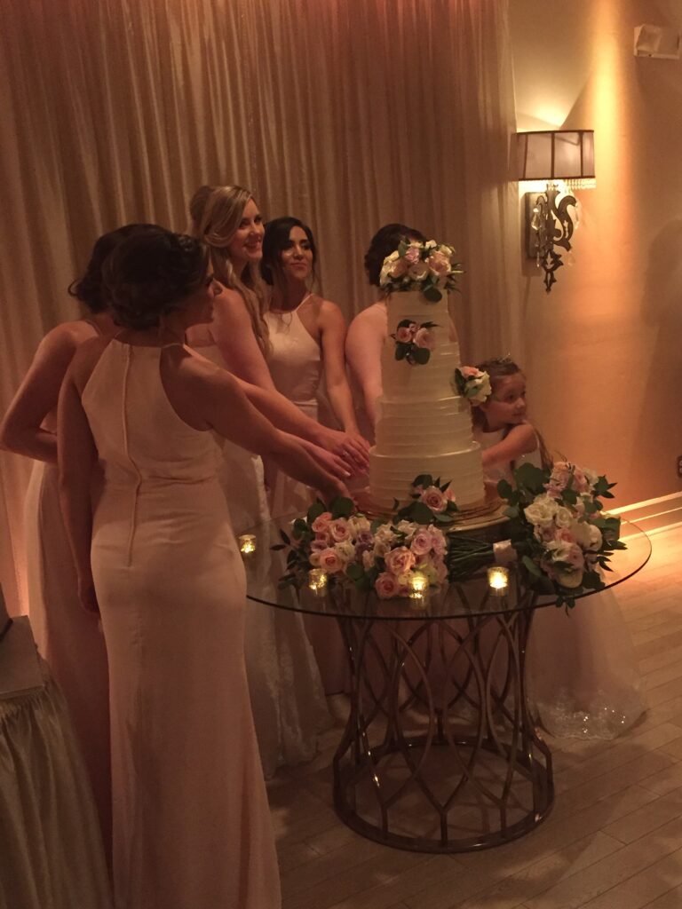 Bridesmaids pulling charms