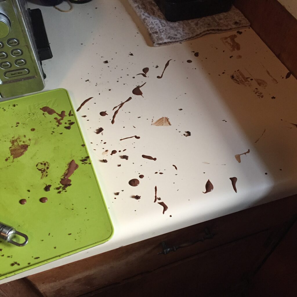 Chocolate splatters on kitchen counter