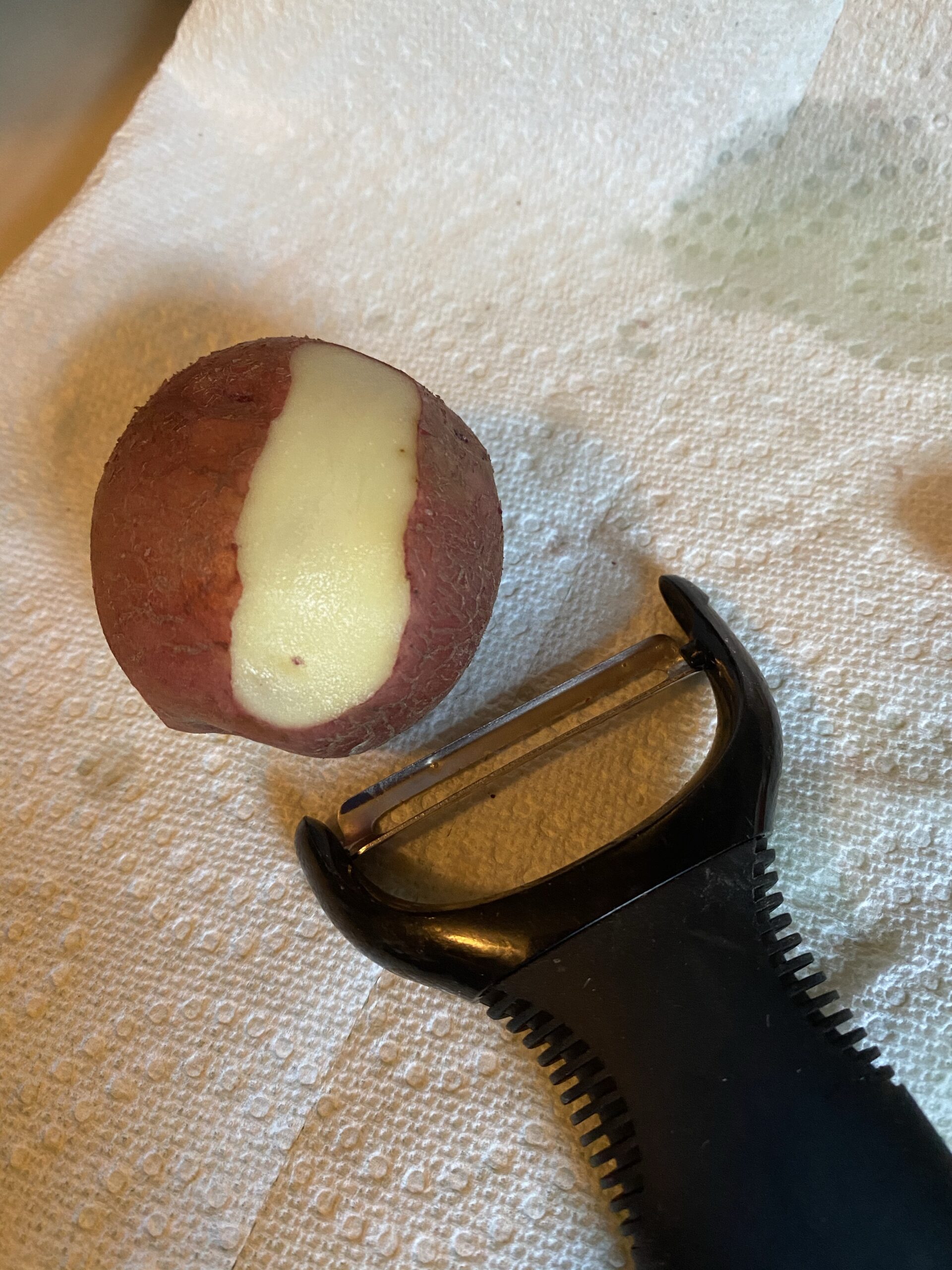 Peeling potato for pot roast