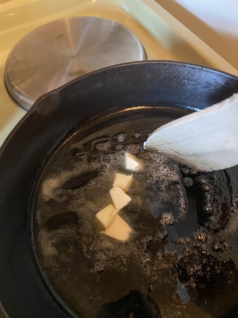 oil and butter heating in pan