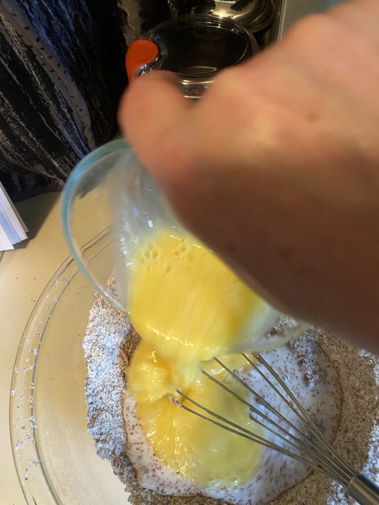 pouring eggs into the mix