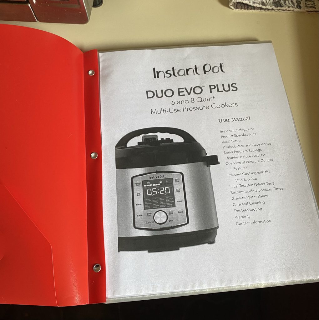 Printed manual for the Duo Evo Plus in a red folder