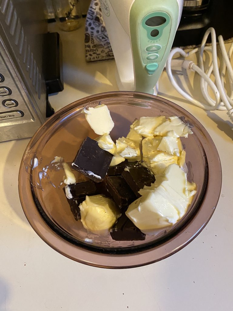 Chocolate and butter chopped in bowl