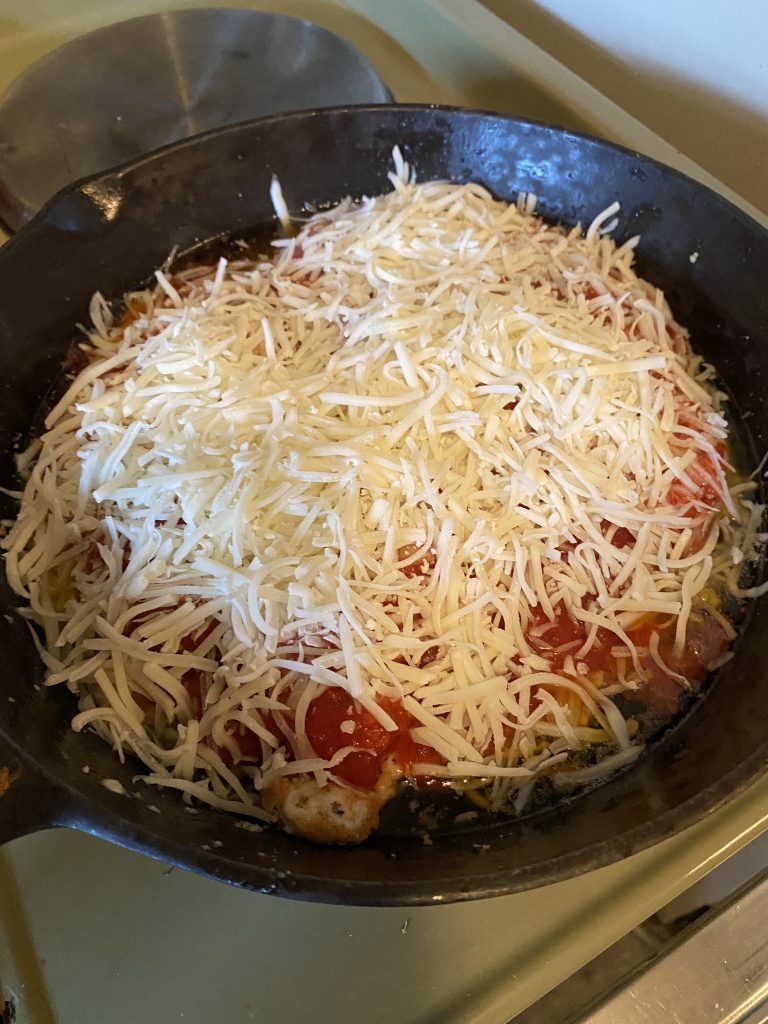 Mozzarella cheese over top of chicken