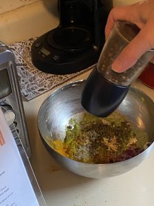 Adding pepper to egg salad