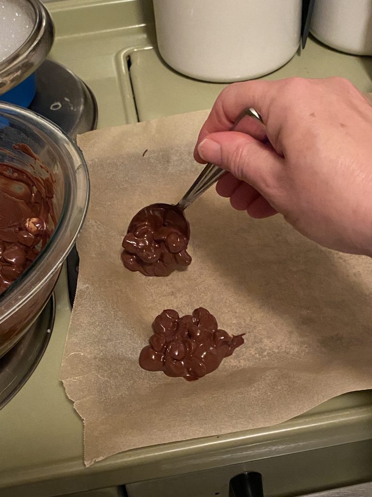 Dropping chocolate onto parchment paper