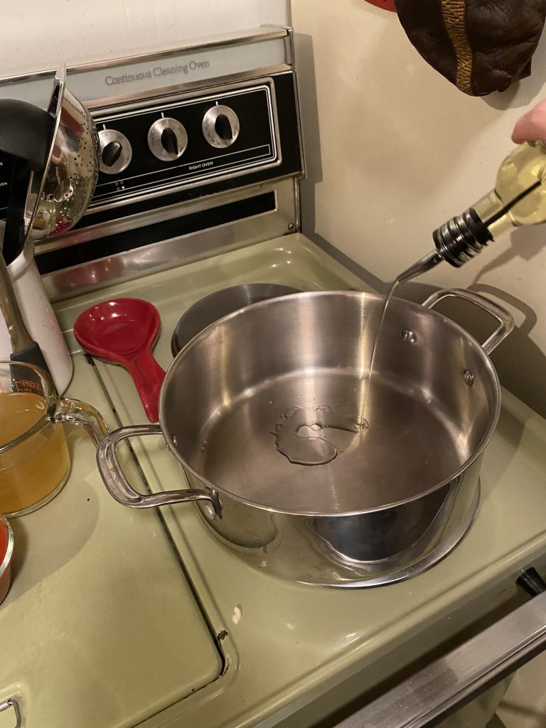 Adding oil to the pot