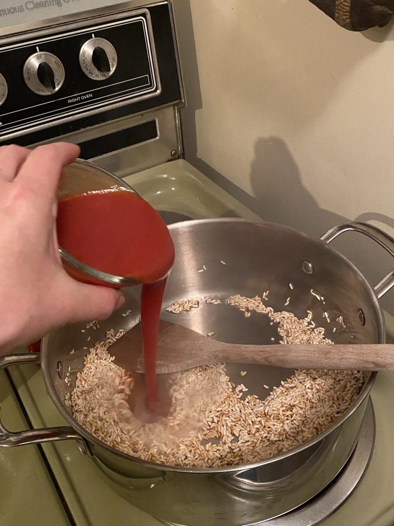 Adding tomato sauce