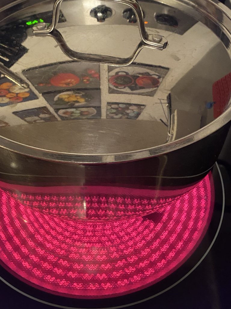 Red glowing coils under cooktop