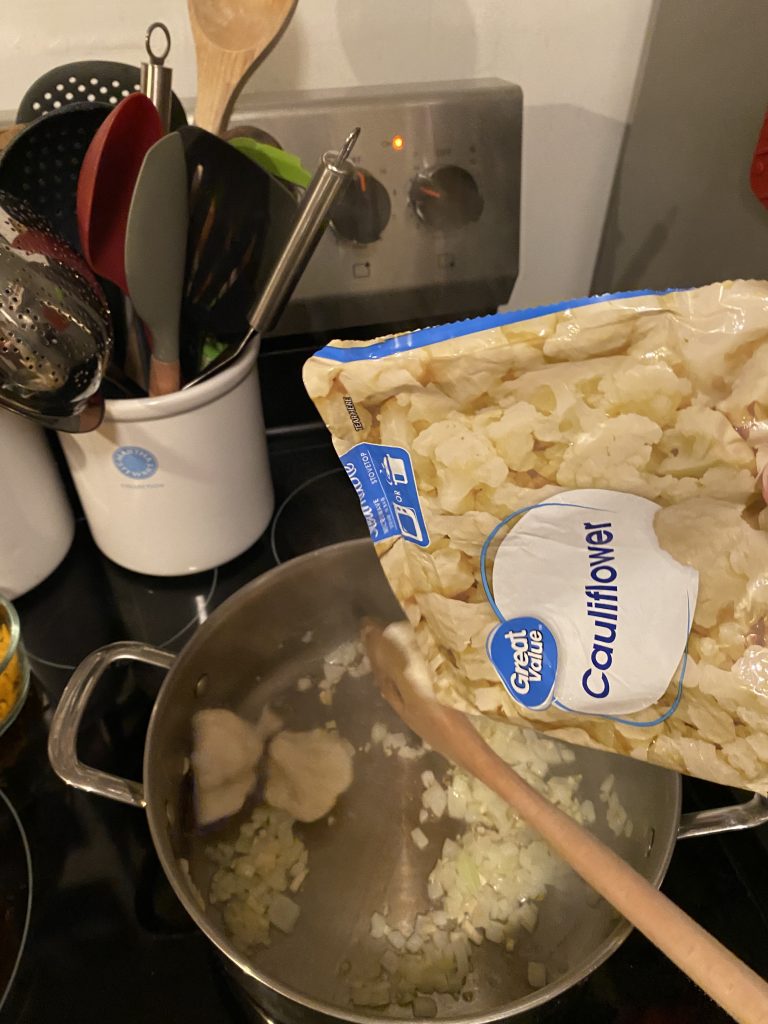 Adding Cauliflower into pot
