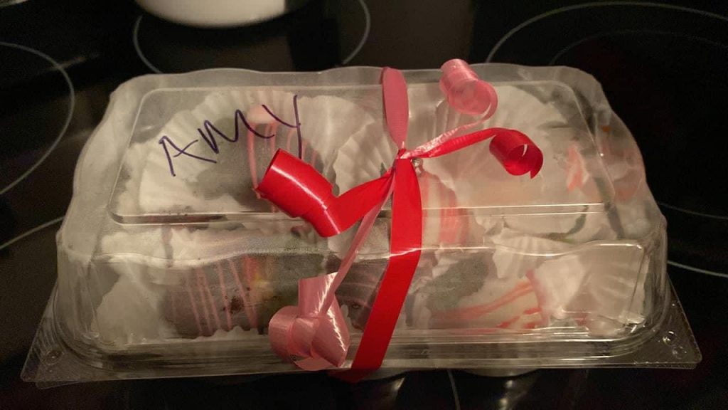 Chocolate covered strawberries in a box wrapped with ribbon