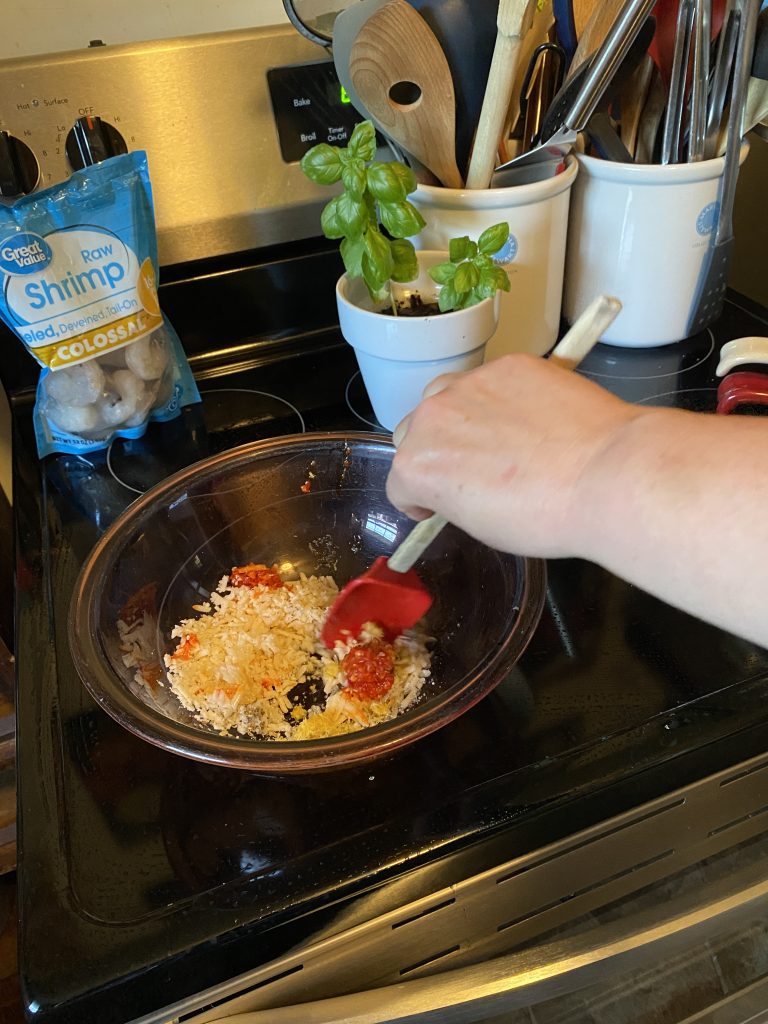 Mixing herb ingredients inbowl