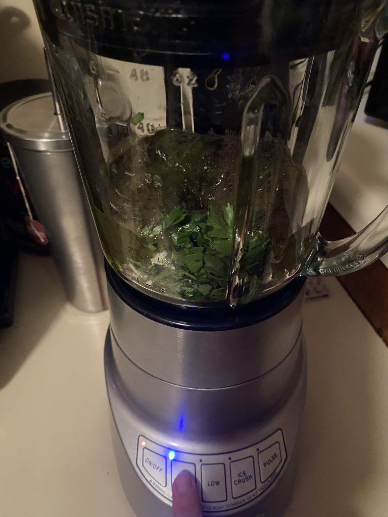 Adding parsley into pesto