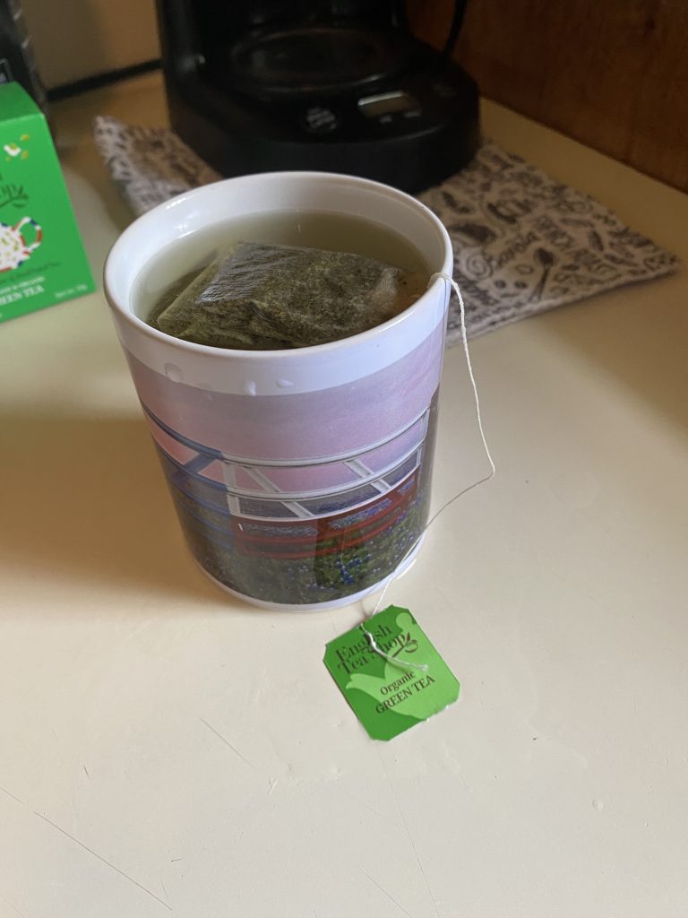 Green tea in a cup with the Texas flag