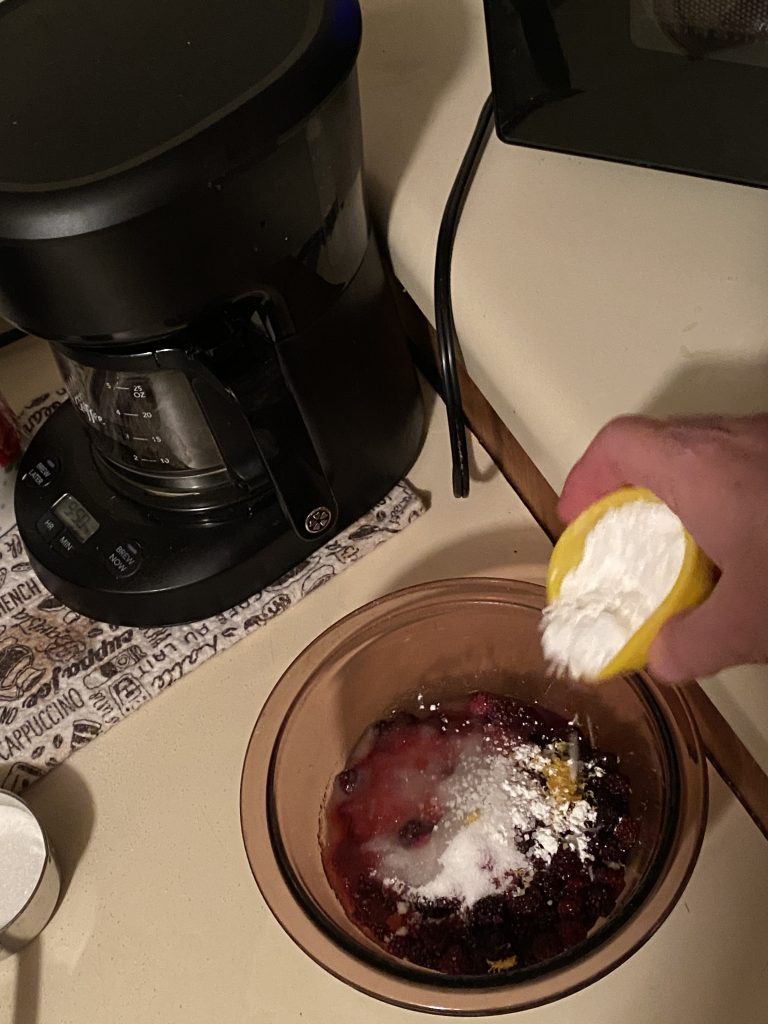 Adding cornstarch to blackberry mixture