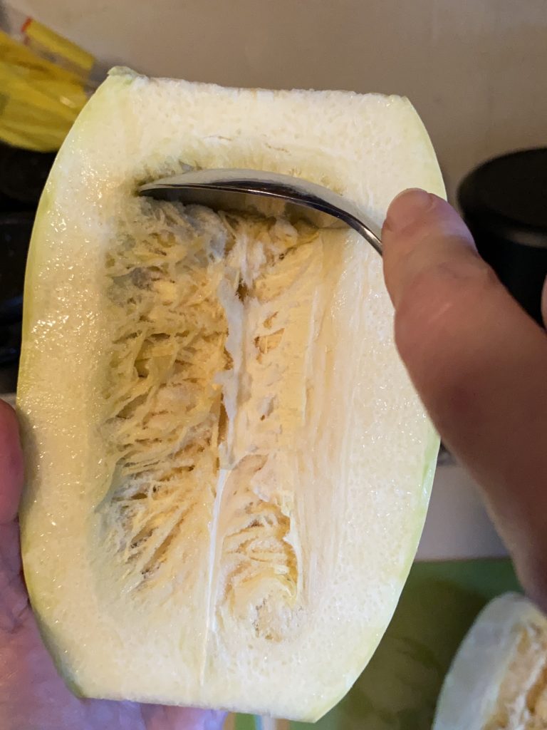 Scraping seeds out of the spaghetti squash