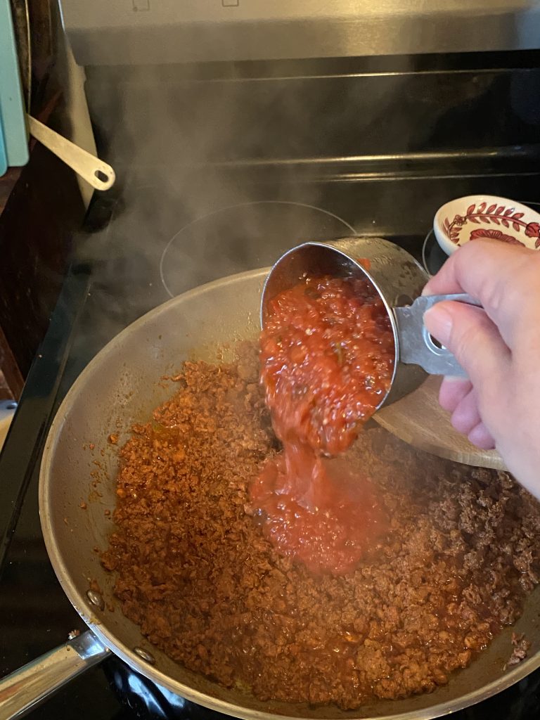 Adding salsa to the pan