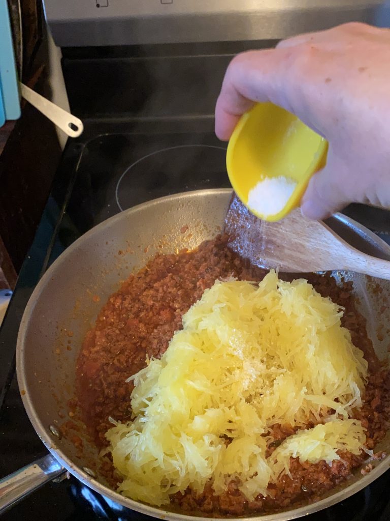 Salt and spaghetti squash added into pan