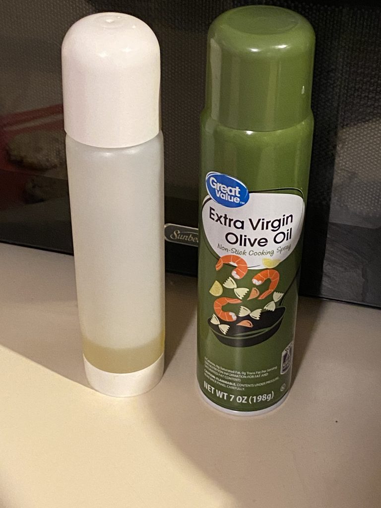Olive oil in a can and oil sprayer