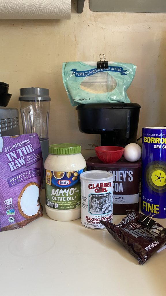 Ingredients to make a chocolate cake in a cup