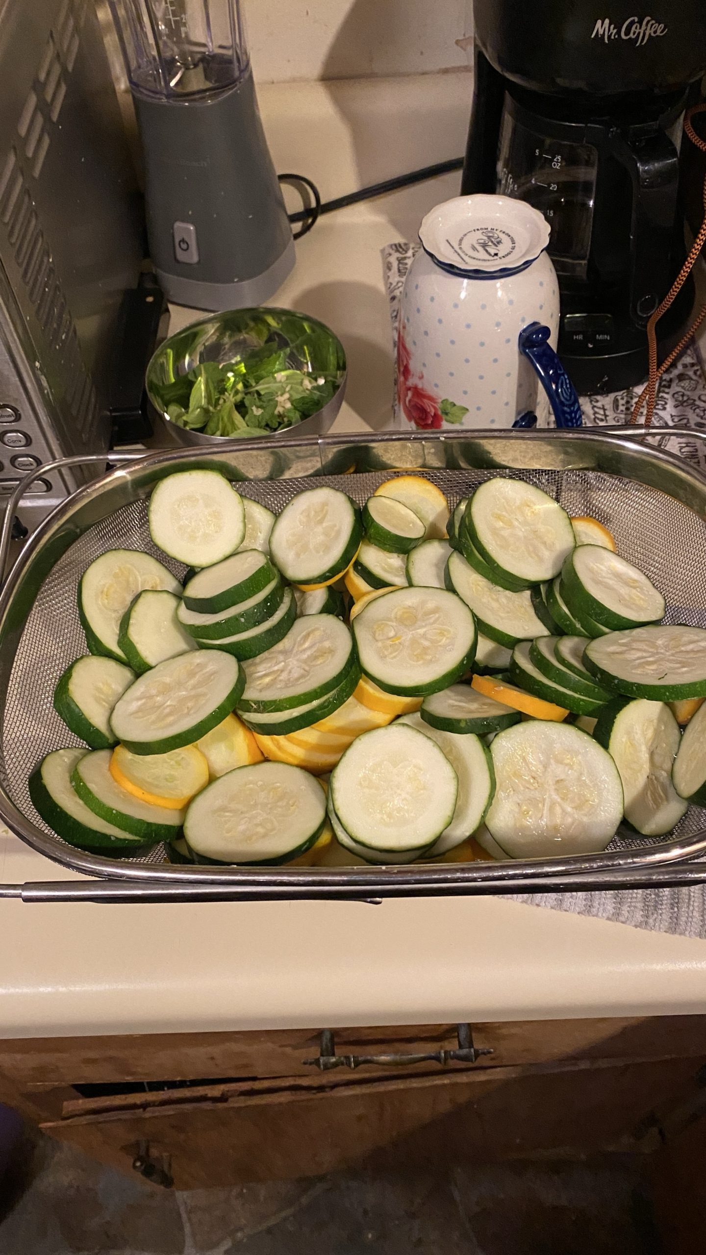 colander basket of cut zucchini