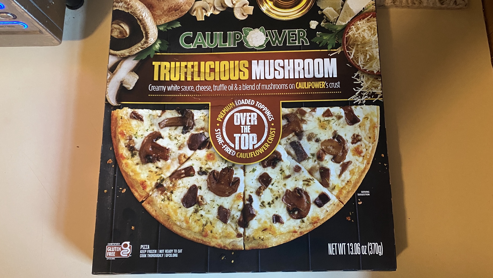 Box of Trufflicious Mushroom Pizza on counter