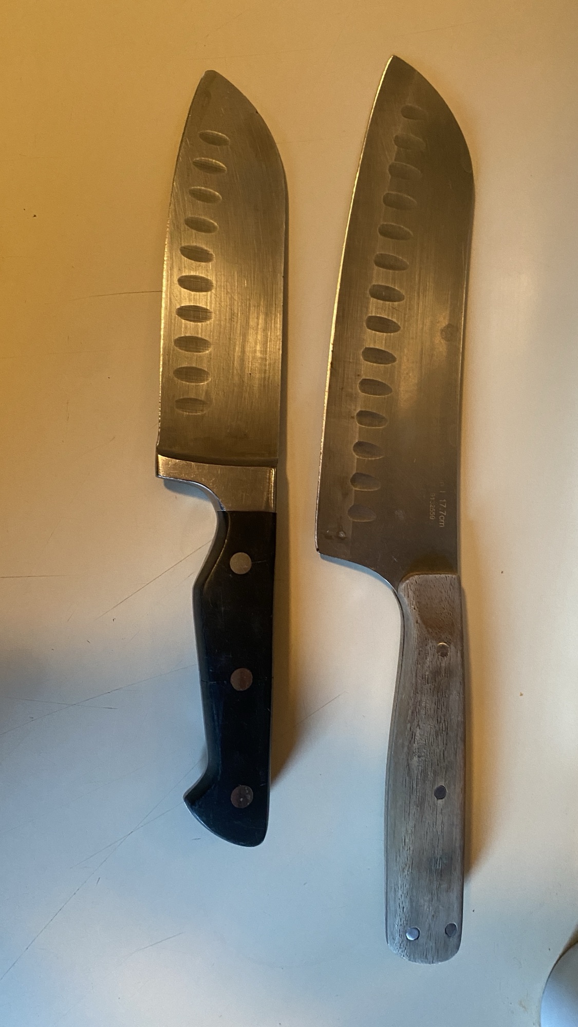 Two knives on a countertop